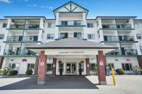 Building with balconies and a covered entrance