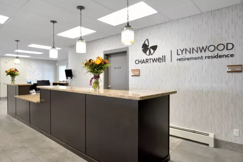 Reception desk beneath pendant lights