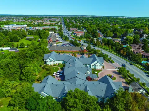 Aerial view of the residence, parking area and surrounding neighbourhood