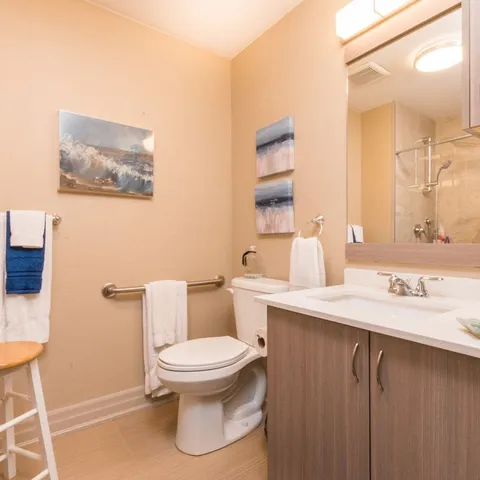 Suite bathroom with a sink, toilet and shower.