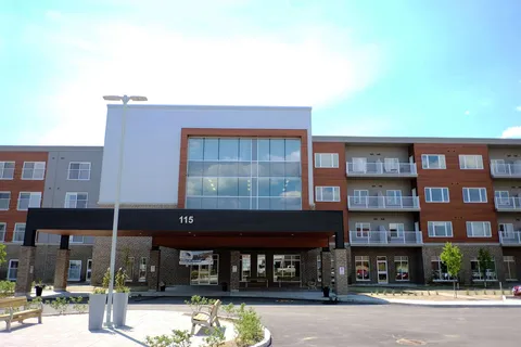 Front of the residence building with its covered entrance.