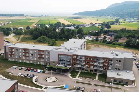 Aerial view of the residence building and entrance driveway.