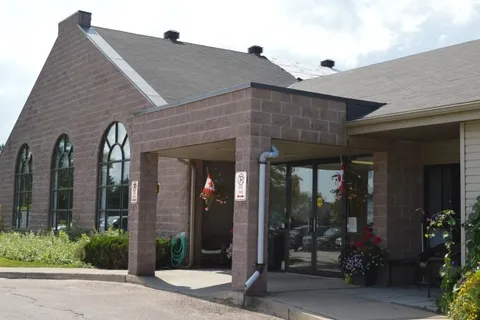 Single-storey residence with stone walls and a covered entrance