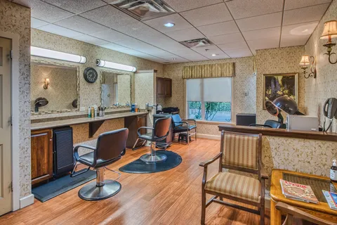 Salon with styling chairs and wall mirrors