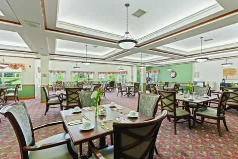 Dining room with set tables, chairs and windows