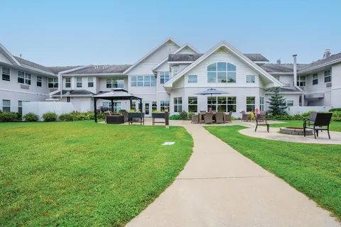 Residence beside lawns, a courtyard and paved paths