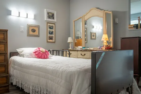 Bedroom with a bed and a window.