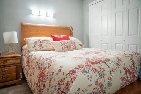 Bedroom with a bed and bedside furniture.