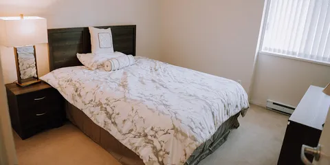 Bedroom with a bed and bedside tables.