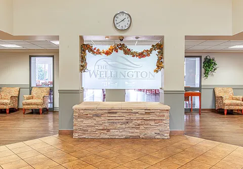 Reception counter with stone facing between seating areas
