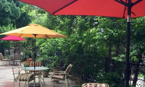 Outdoor patio tables beneath parasols