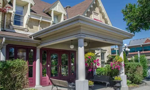 Residence facade with bay windows and a covered porch