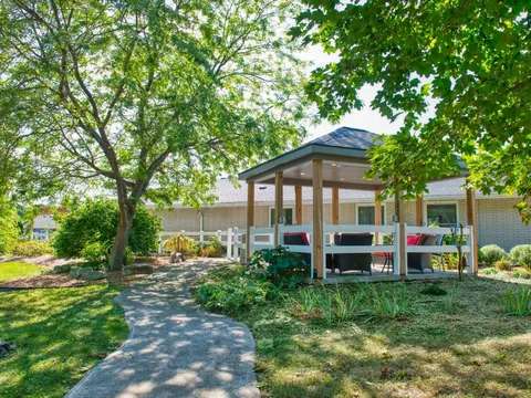 Garden path leading to a gazebo with seating