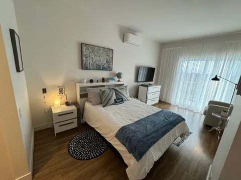 Bedroom with a bed and bedside tables.