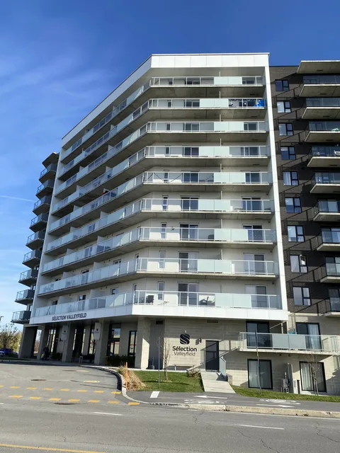 High-rise residence with balconies facing the street.