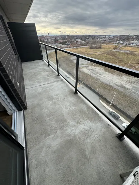Private balcony with a glass railing.
