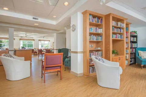 Seating and bookshelves beside the dining room.