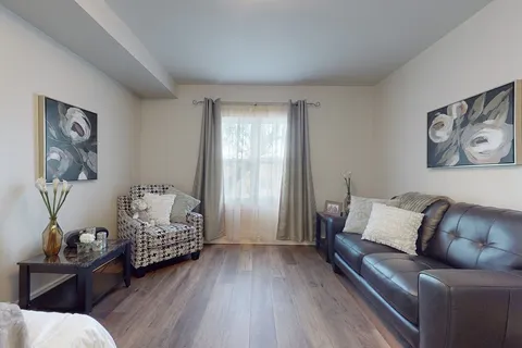 Suite living area with a sofa and armchairs.