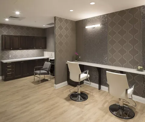 Salon with styling chairs, mirrors and wood cabinets
