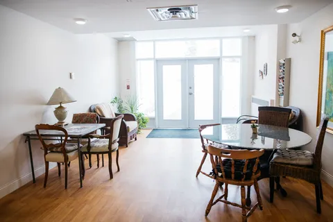 Sunny sitting area beside a glass exit door