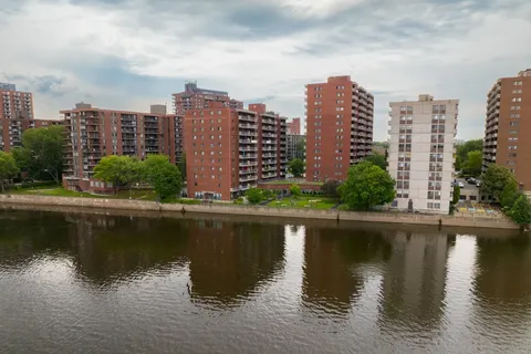 Residence towers beside the river.