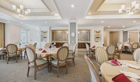Dining room with round tables and upholstered chairs