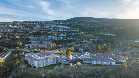 Aerial view of the residence campus with surrounding streets and hills.