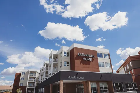 Exterior showing the entrance canopy and upper balconies.