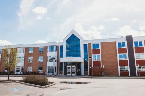 Building exterior with glass entrance facade.