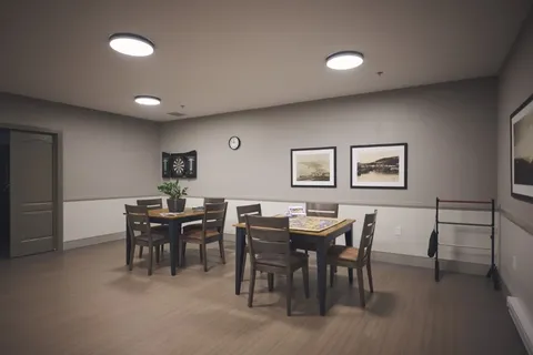 Private dining room with tables and chairs.