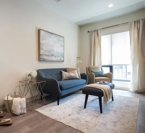 Suite living area with a sofa and armchairs.