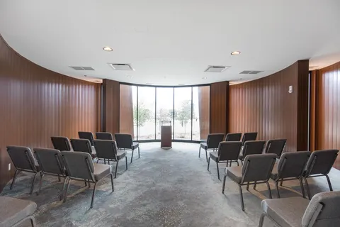 Chapel with rows of chairs facing a lectern.