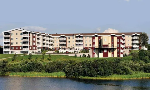 Residence building seen across the river.