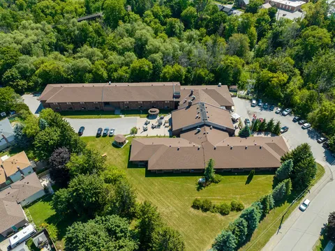 Aerial view of the residence rear wings and lawn