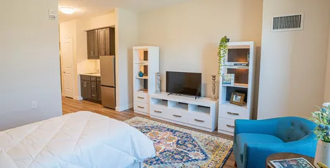 Bedroom with a bed, bedside tables and a bench.