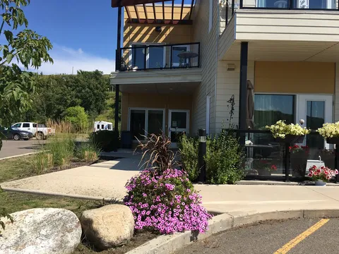Residence entrance viewed across the landscaped forecourt.