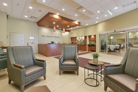 Reception desk and seating beside glass doors to the dining room
