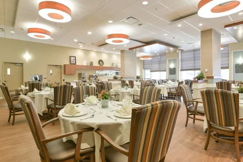 Dining room with set tables and circular pendant lights