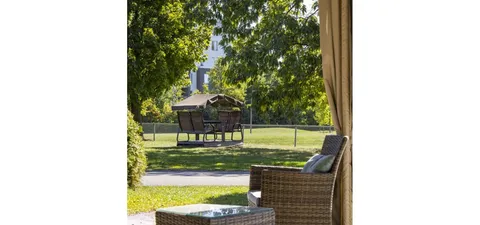 Garden lawn and swing seat viewed from the covered patio