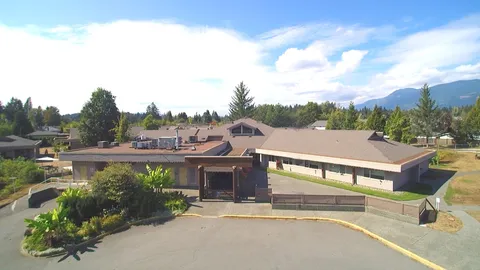 Aerial view of the Rainbow Gardens building and paved frontage.