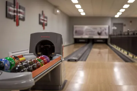 Bowling lane with balls in the foreground.