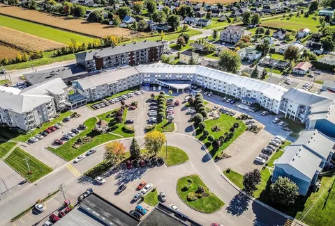 Aerial view of the residence complex, gardens and parking areas.