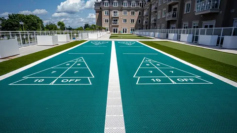Outdoor shuffleboard courts beside the residence.