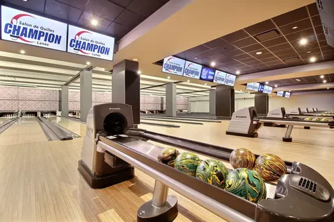 Bowling lanes with a ball-return rack.