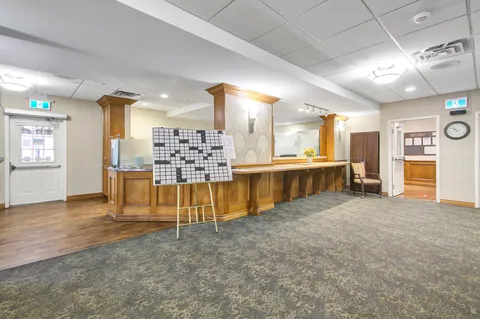 Room with a large crossword board and a wooden counter