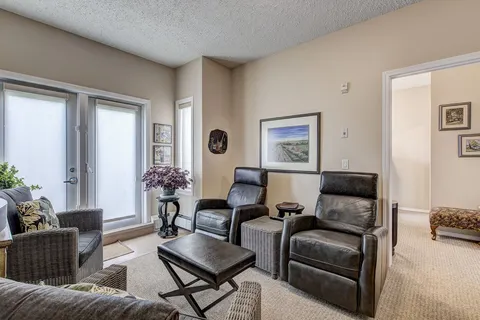 Suite sitting area with two reclining chairs and a window.