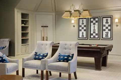 Bistro seating with a pool table in the background.
