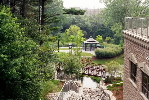 Garden paths, bridge and gazebo beside the residence.