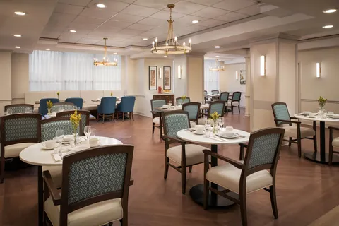 Dining room with set tables and pendant lights