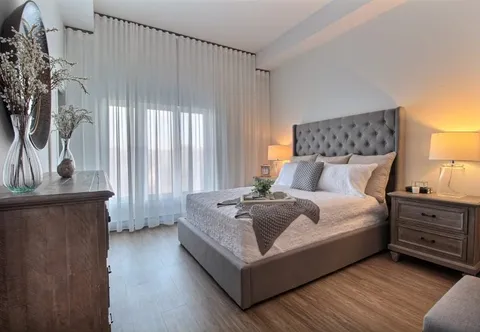 Bedroom with a double bed and wooden bedside furniture